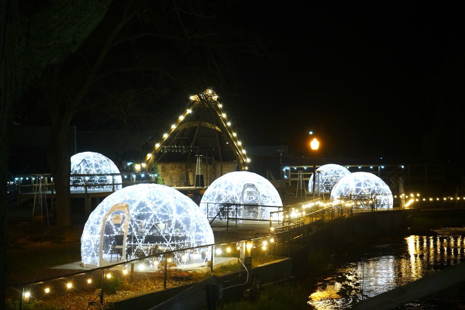 Cheerfully lit winter domes (igloos) at Warner Vineyards along the Paw Paw River in Paw Paw, Michigan.